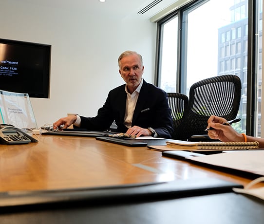 Two lawyers discussing a case at a conference table